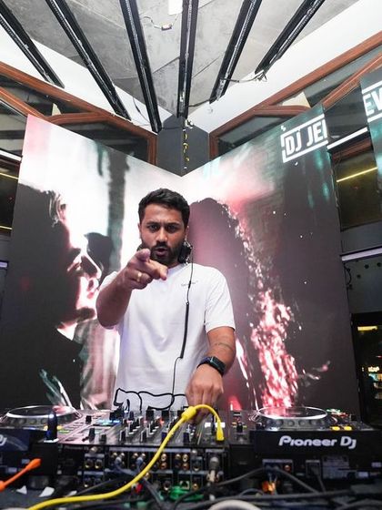 Behind the decks at FLO Church Street, with my custom branding in the background. It's always a pleasure playing at this amazing venue.