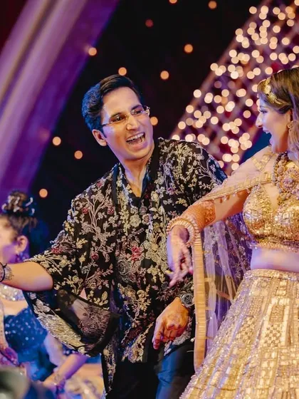 A perfectly choreographed dance move between the couple, showcasing their chemistry and the fun they're having.