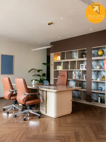 This executive cabin at the Brandman project is where power meets presence. We designed a space that balances authority with personal comfort, using rich textures, herringbone flooring, and custom shelving to create a sophisticated and productive environment.
