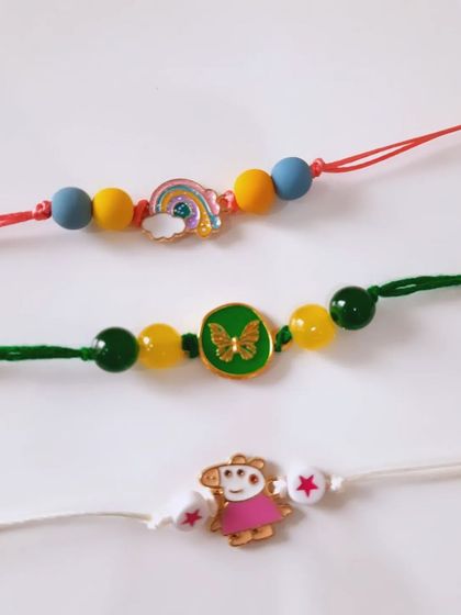 A few of my favorite kids' Rakhi designs. I have Peppa Pig for the little ones, a rainbow charm for the dreamers, and a butterfly for a touch of sparkle. All are made with colorful beads and soft threads.