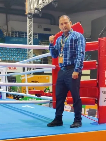 A photo of me in the ring. This is my element, and I am dedicated to sharing my passion and knowledge of boxing with every student who walks into my academy.