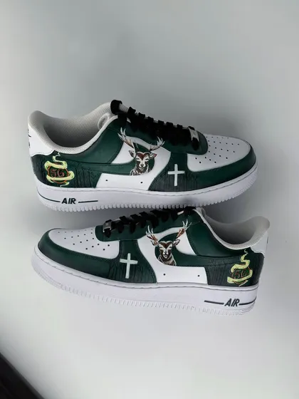 A top-down angle showing the inner design of the Jägermeister sneakers. We ensure every part of the shoe is considered, with custom details like the stag logo and cross symbol perfectly placed.