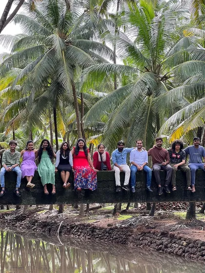 A group photo on a coconut log bridge.