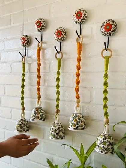A beautiful set of our macrame ceramic bells in a combination of evergreen and orange. You can customize your set by choosing your favorite colors to match your home's aesthetic.