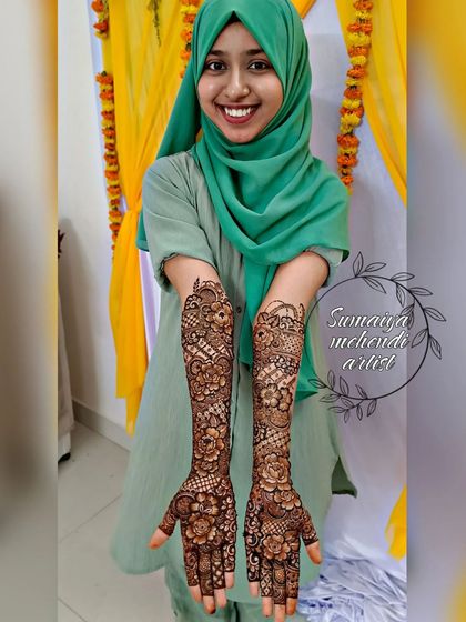 The lovely Sara showing off her full bridal henna. Her smile says it all. It was such a pleasure to create this floral design for her.