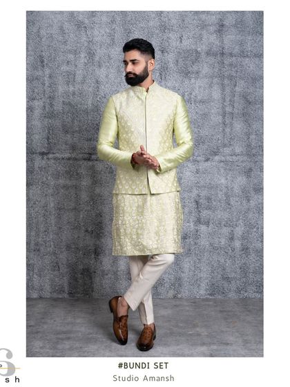 Our mint green bundi set offers a cool and sophisticated option for summer events. Both the jacket and kurta feature intricate, tonal Resham embroidery for a cohesive and elegant look.