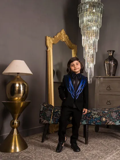 Here is a look at my custom wire detailed tuxedo. The jacket features striking blue satin piping on a black base, creating a modern and sharp silhouette for any formal occasion like a wedding or a milestone birthday party.