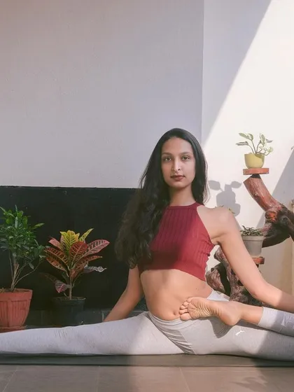 This is Vamadevasana, a challenging seated pose that deeply opens the hips and stretches the quadriceps. It's a testament to what the body can achieve with dedicated practice. My goal is to help you explore your potential, one breath at a time.