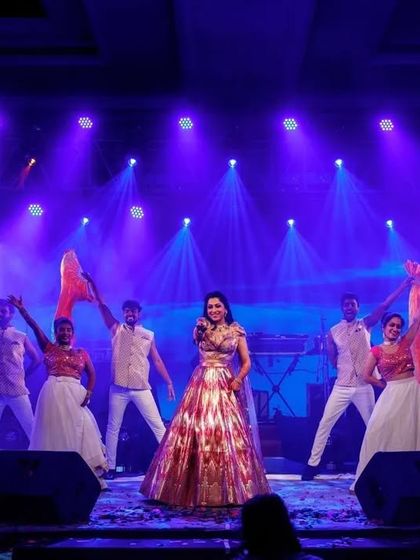 A bride's solo performance complete with fog and backup dancers. These production elements help create a dreamy and theatrical atmosphere for her special moment.