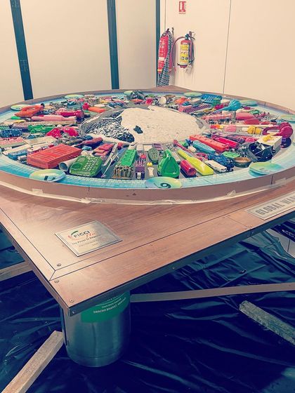 Preparing the 10-foot circular panel for installation. The logistics of creating and mounting a piece of this size are complex, but essential to bringing the vision to life.