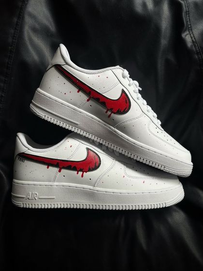 Another pair shot of the red drip custom sneakers.