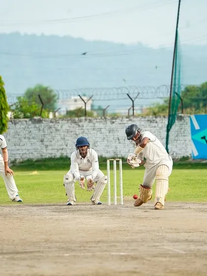A classic Test match scenario. The batsman is focused, with the wicketkeeper and slips cordon waiting for an edge. Our tours provide invaluable experience in traditional, long-format cricket.