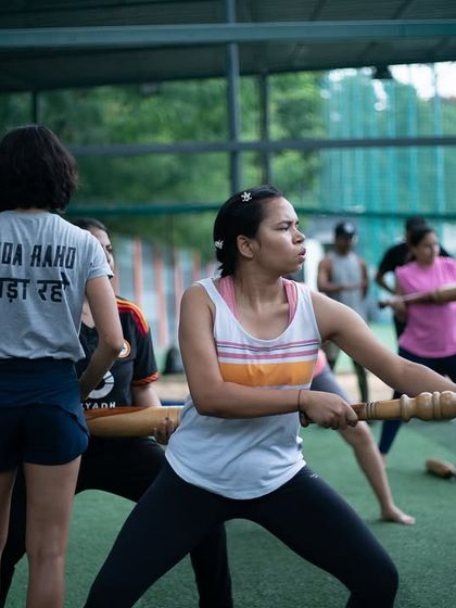 A group of women engaged in a dynamic workout with Gadas. This image shows the energy and focus of our training sessions, where everyone moves together, building strength and community.