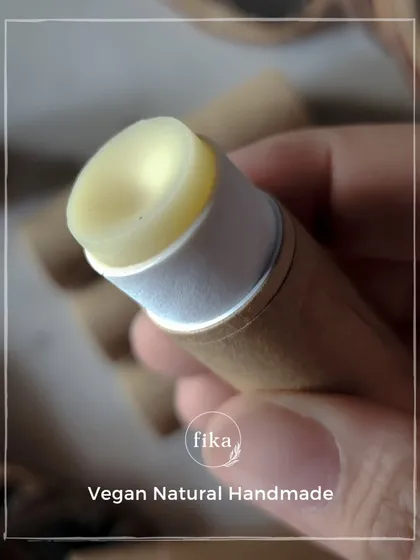 A close-up of my vegan, natural, handmade lip butter. The formula is designed to be super gentle and nourishing, and the push-up paper tube makes it easy to use and eco-friendly.