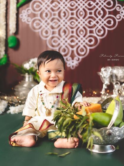 A happy little boy celebrating the festival of Ugadi with a big smile.