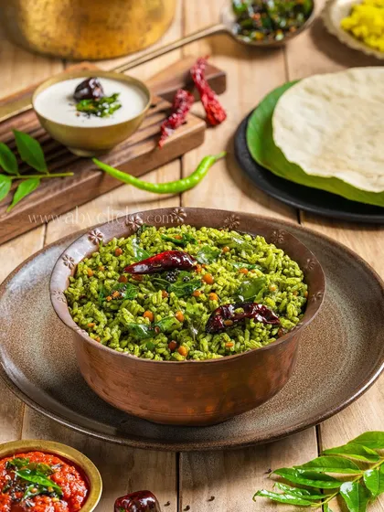 A healthy and vibrant Spinach Rice, served in a traditional copper bowl.