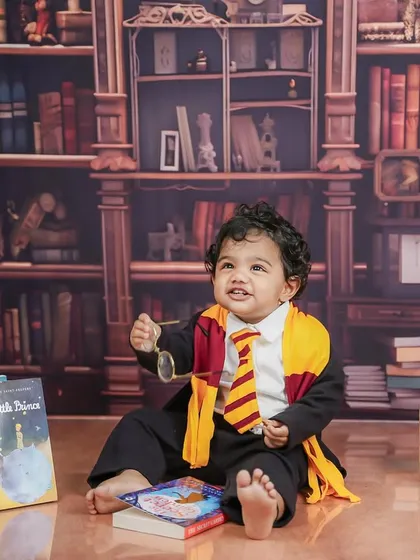 A playful moment, holding up his glasses. These little candid actions make for the most memorable photos.