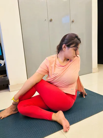 Another angle of the seated spinal twist, showing the student's focus and proper alignment. It's wonderful to see students find comfort and depth in their poses during our one on one classes.