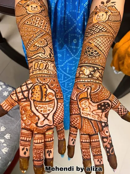 The full view of the matching baby shower mehendi for the happy couple.