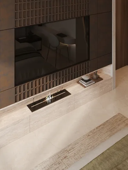 The TV wall opposite the bed features intricate, dark wood paneling with a grid-like texture, adding depth and a sense of craftsmanship. A small, modern fireplace is integrated below.