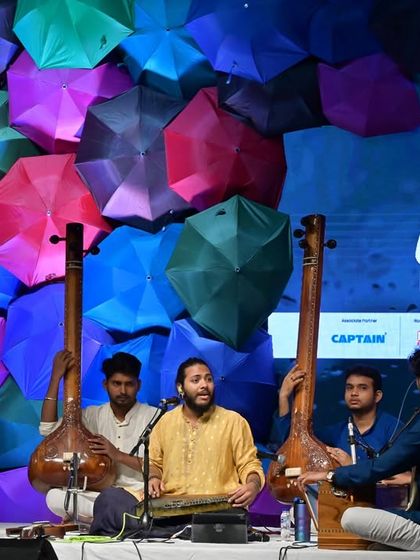A candid moment of musical interaction on stage. These spontaneous exchanges between artists are what make live performances so special.