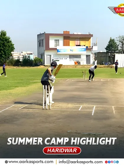 A practice match underway at our Haridwar summer camp, with our academy building in the background.