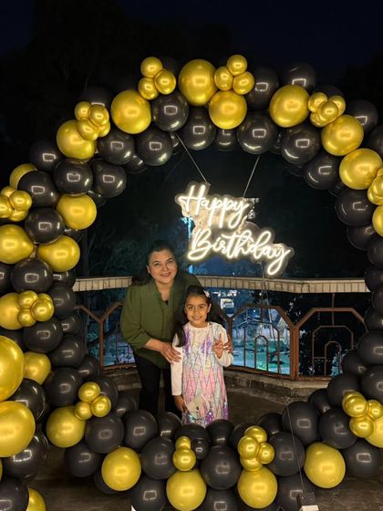 The decorations are perfect for all ages, as shown by this mother and daughter posing at the terrace party.