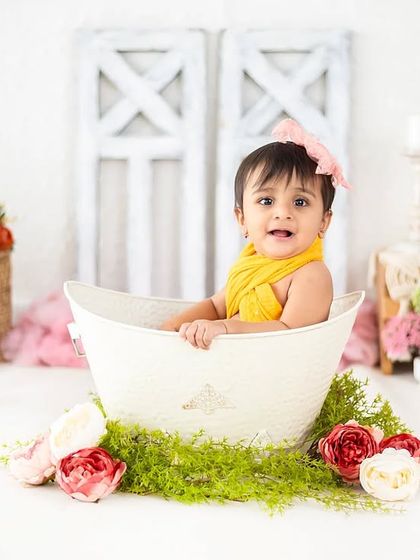 A fun and unique floral bath time shoot. We can create custom setups like this for a playful and beautiful session.