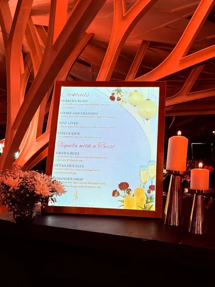 Another angle of the custom-designed backlit menu, showing how it serves as both an informational piece and a beautiful decorative element on the bar.