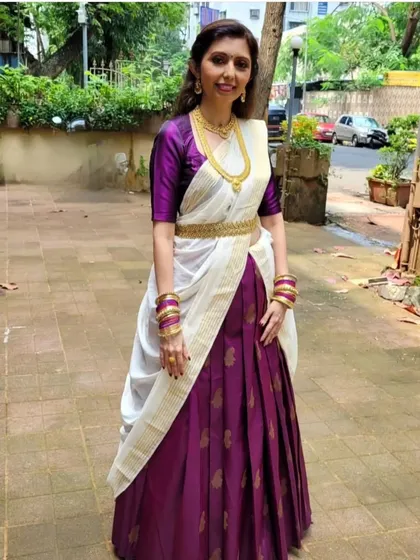 Here, I have combined a Kanjeevaram and a Kasavu saree to create a unique half-saree or lehenga look. This demonstrates how you can mix and match sarees for a truly personalized style.
