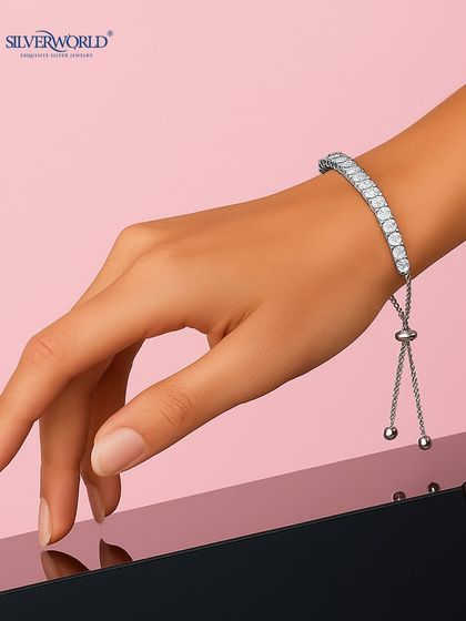 Our version of the classic tennis bracelet, this piece features a line of sparkling zirconia stones and an adjustable slider clasp for a perfect fit. It's sporty, chic, and elegant.