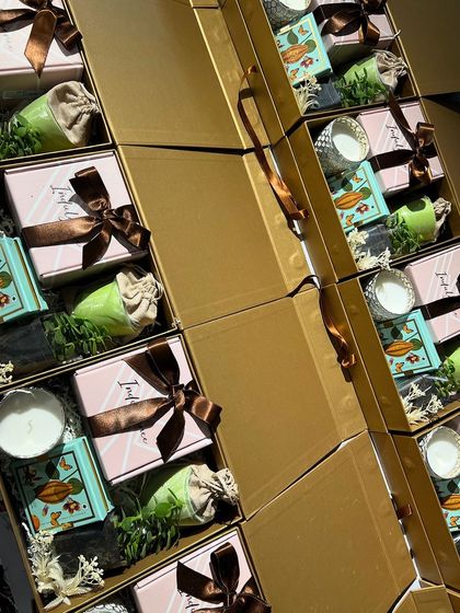 Stacks of our beautifully curated corporate gift boxes. This image showcases the scale of orders we can handle while maintaining a high standard of quality and aesthetic appeal.