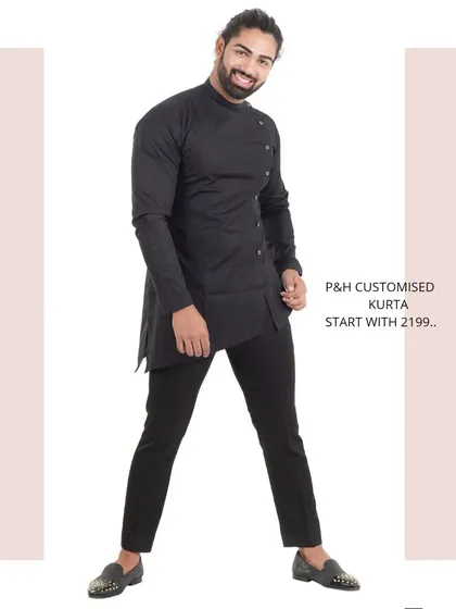 A full-length shot of the black asymmetrical kurta, capturing its modern and edgy vibe.