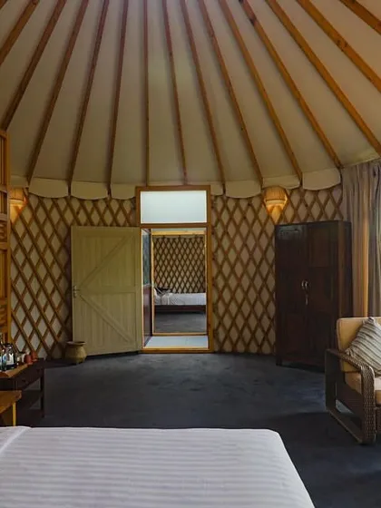 Step inside our unique riverside yurt-style cottages at Kanakapura. These spacious and airy rooms offer modern comforts with a rustic charm, providing a private and serene retreat for your team to rest and recharge.