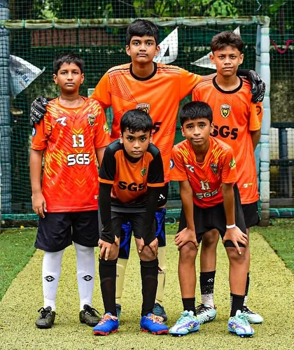 A team photo capturing the focus and determination of our players before a match at the Inter SG5 Cup.