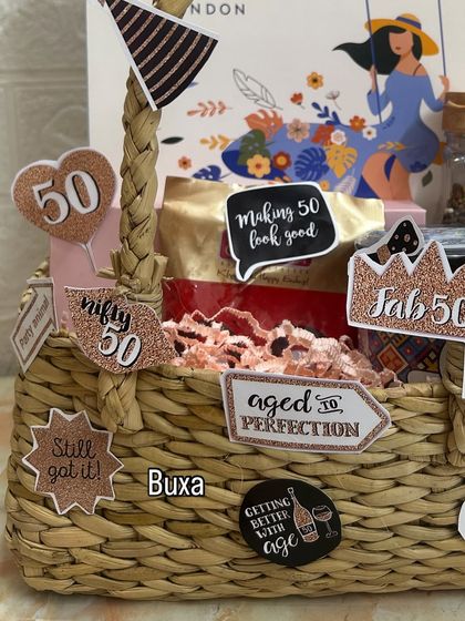 A close-up of the "Fifty & Fabulous" hamper, showing the fun, glittery cutouts and the Yardley London gift set in the background.