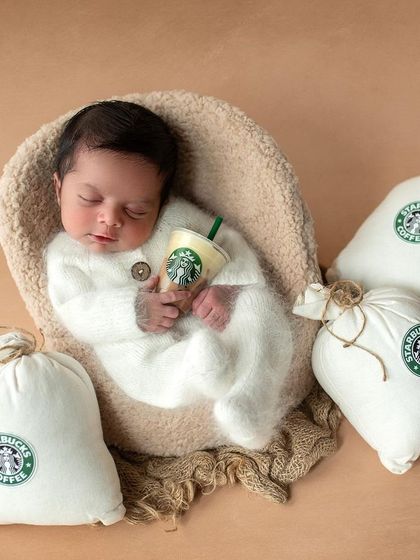 Our little caffeine connoisseur holding his very own tiny Starbucks cup. This was such a fun and personal theme to create for the family.