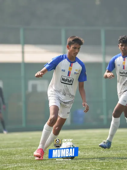 A player scans the field, demonstrating the game intelligence and awareness we cultivate in our training sessions.