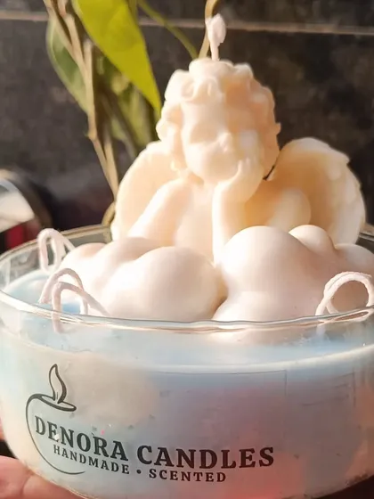 The angel and cloud jar candle, featuring my brand logo.