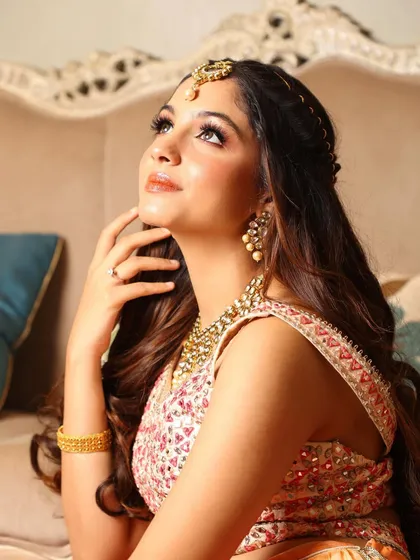 A dreamy, upward gaze capturing the ethereal quality of this mehendi look.