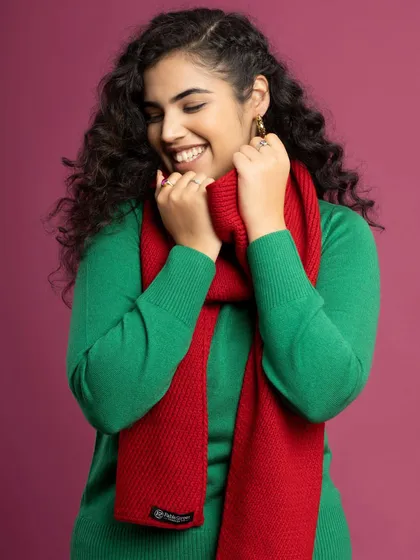 Getting cozy for the winter campaign. This green sweater and red scarf combo is a classic Christmas look.