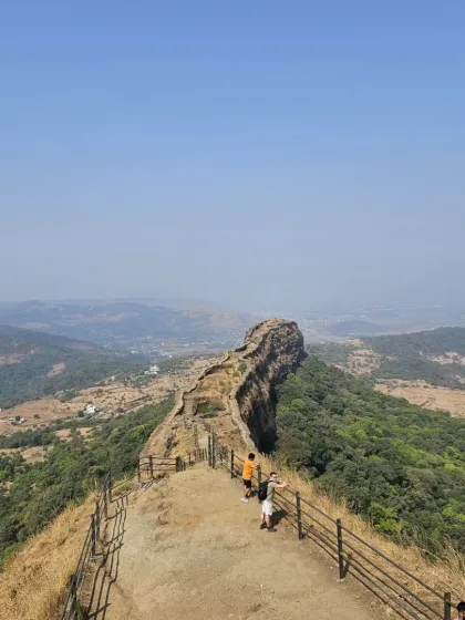 The breathtaking view from the 'Vinchu Kata' (scorpion's tail) viewpoint at Lohagad fort. The vast landscape and dramatic terrain are perfect subjects for sketching.