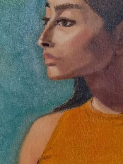 A close-up of the finished portrait, showing the subtle blending of colors on the skin and the texture of the background. Learning to handle oil paints to create these effects is a focus of my advanced classes.