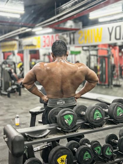 The back view of my recent gains. Building a thick, powerful back is a top priority.