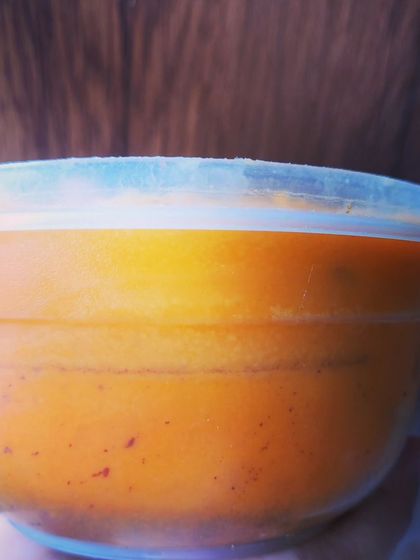 A container of my homemade pork lard, showing its beautiful golden hue. This is a pure, unadulterated cooking fat that will elevate your dishes.