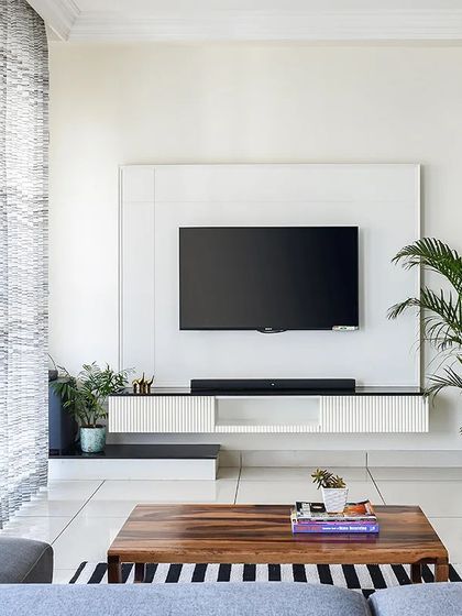 The client wanted a simple, sleek, and minimal TV unit. I designed this floating console with clean lines and subtle fluting details on the drawers to keep it sophisticated and clutter-free.