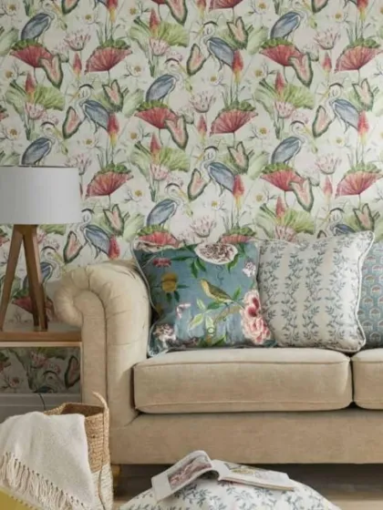 This living room uses a wallpaper with a pattern of herons and water lilies. The design is available in multiple colorways to match any interior decor.