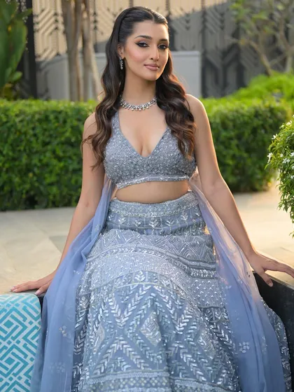 Seated in a beautiful outdoor setting, the makeup catches the light perfectly. We teach how to create looks that are stunning in any lighting, day or night.