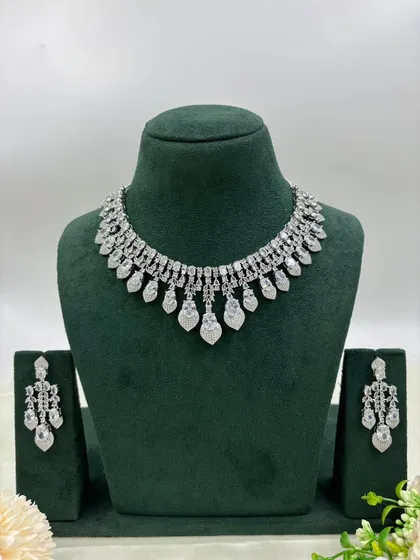 The leaf-shaped necklace with all-white stones.