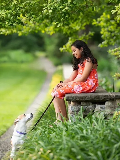 A sweet moment between a girl and her dog. Capturing these bonds, whether with pets or siblings, is what makes a photo session so meaningful.